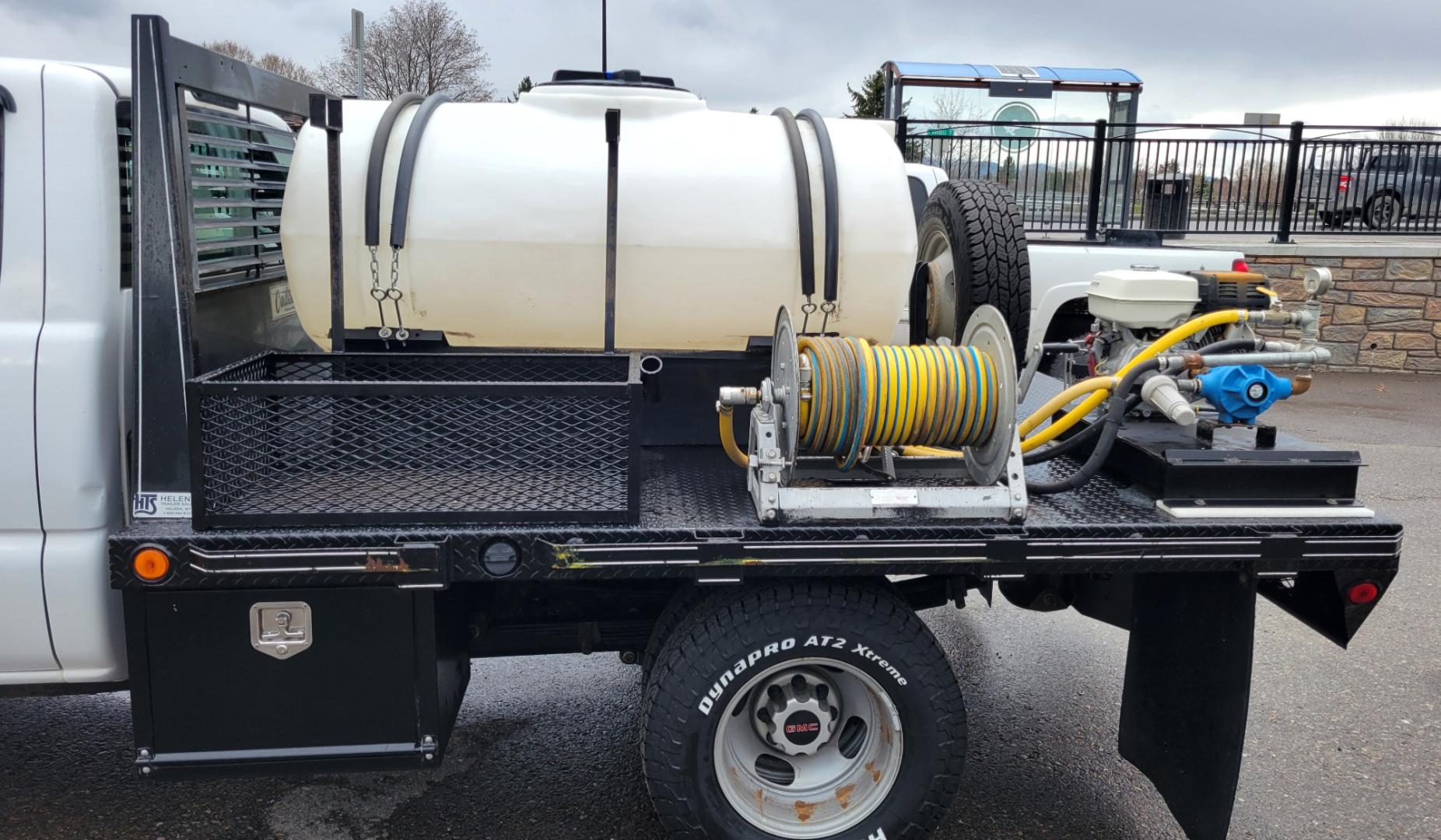 2005 White /Black GMC Sierra 3500 Ext. Cab 4WD (1GDJK39G65E) with an 8.1L V8 OHV 16V engine, Automatic transmission, located at 450 N Russell, Missoula, MT, 59801, (406) 543-6600, 46.874496, -114.017433 - One Owner Beast of a Truck. 8.1l v8 Engine. 4 Wheel Drive. Automatic Transmission. Dual Rear Tires. Air Conditioning. AM FM. Water Tank. 8hp Honda {Pump with two Hose Reels and Sprayers. - Photo#4